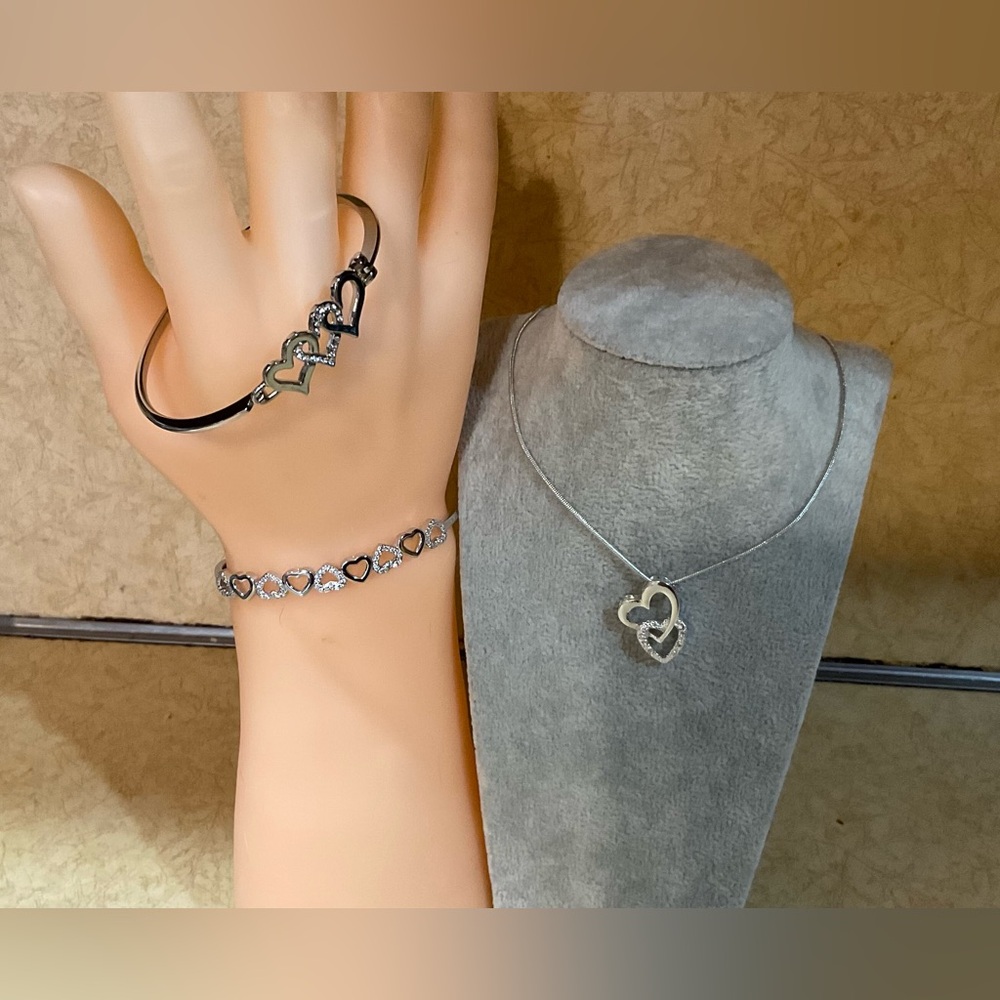 Swarovski: 3 piece set of silver (925) plated/toned hearts bangles and necklace.